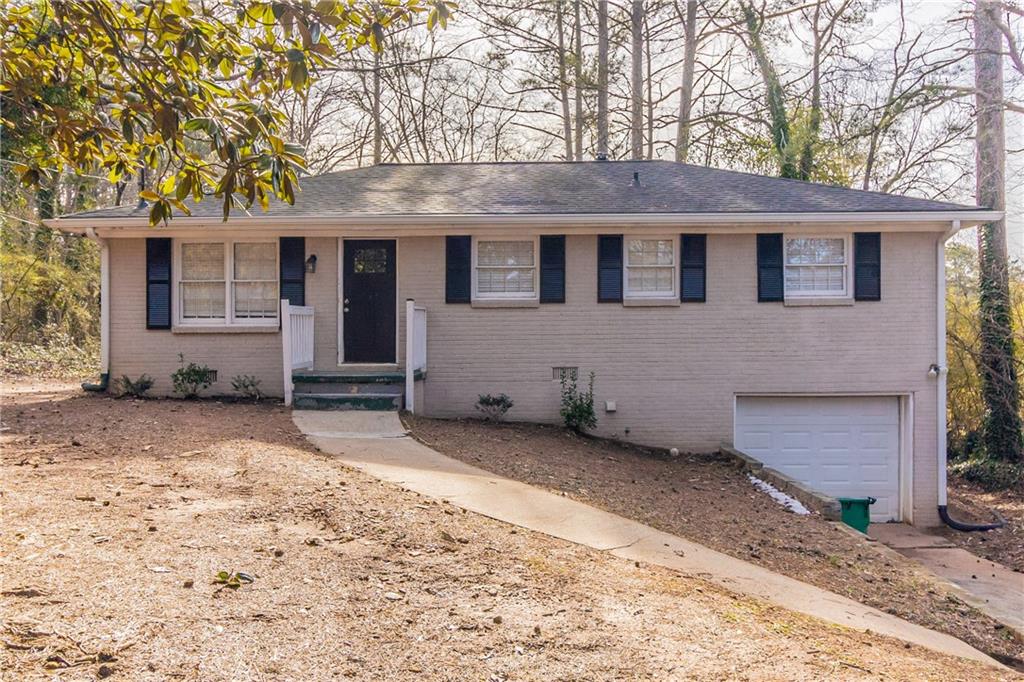4083 Thetford Court Decatur, GA 30035 - Photo 1 of 1 a front view of a house with a yard