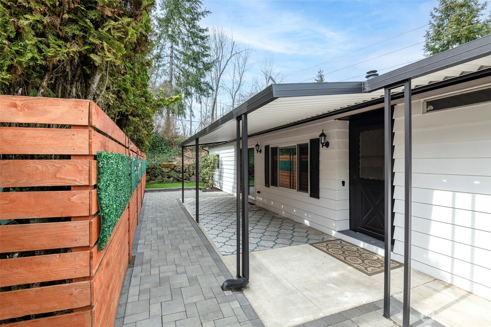 201 Union Avenue Southeast, Unit 157 Renton, WA 98059 - Photo 2 of 33 a view of a house with a porch