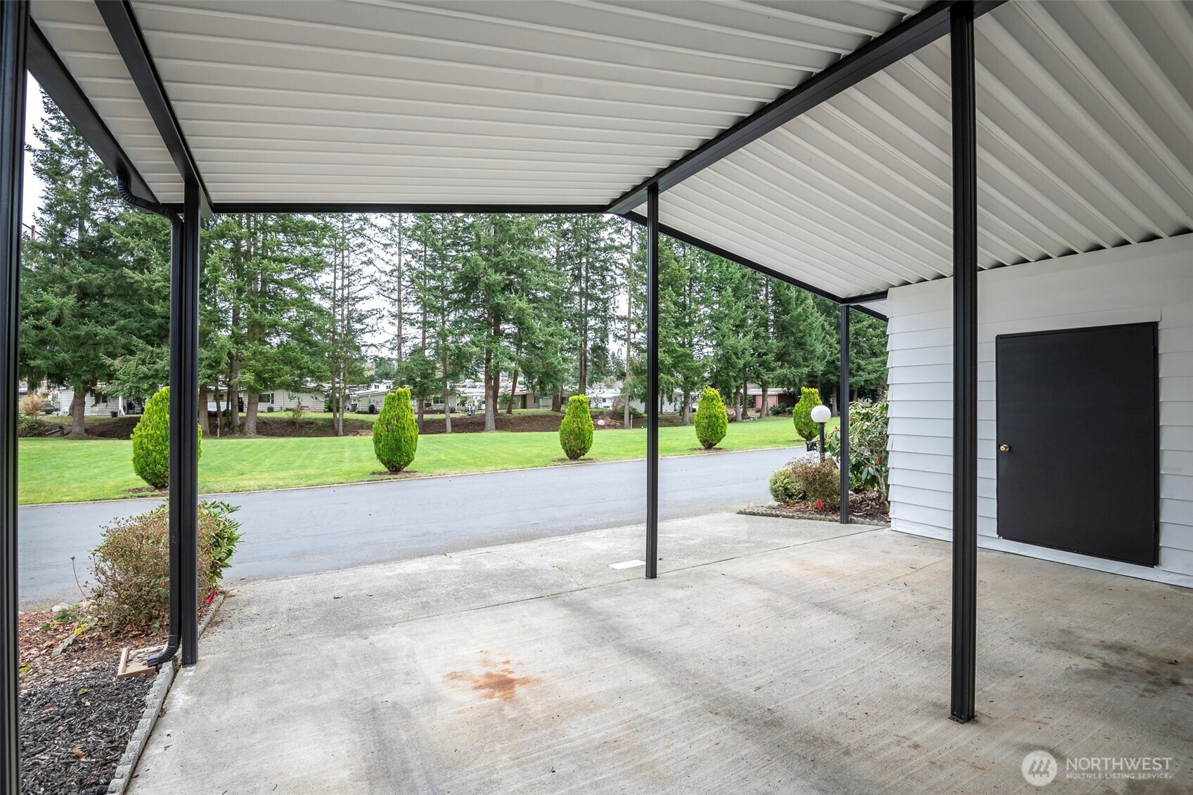 201 Union Avenue Southeast, Unit 157 Renton, WA 98059 - Photo 24 of 33 a view of a house with backyard and a porch