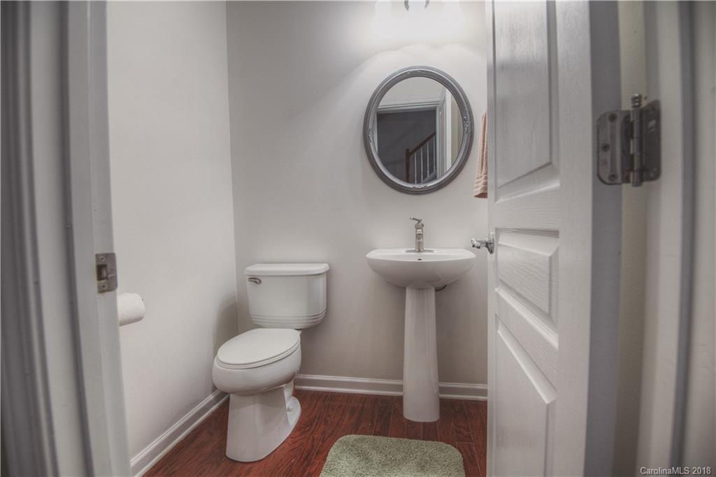 581 6th Baxter Crossing, Unit 1 Fort Mill, SC 29708 - Photo 14 of 34 a bathroom with a sink toilet and a mirror