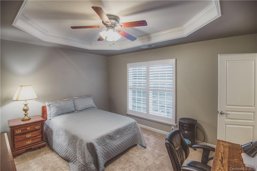 581 6th Baxter Crossing, Unit 1 Fort Mill, SC 29708 - Photo 17 of 34 a bedroom with a bed and window