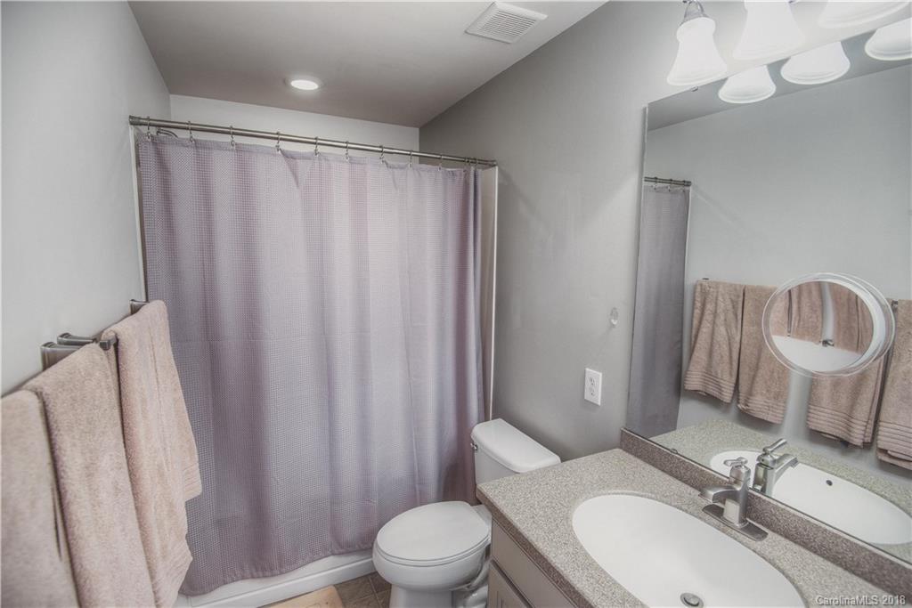 581 6th Baxter Crossing, Unit 1 Fort Mill, SC 29708 - Photo 18 of 34 a bathroom with a sink toilet and shower
