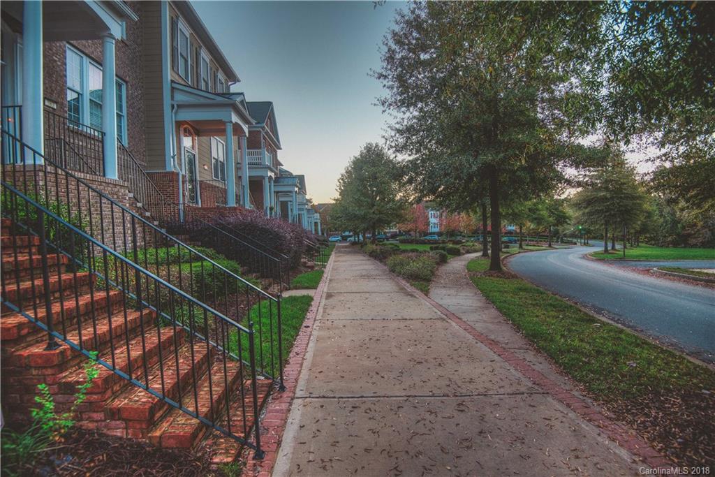 581 6th Baxter Crossing, Unit 1 Fort Mill, SC 29708 - Photo 3 of 34 a view of a street with brick walls