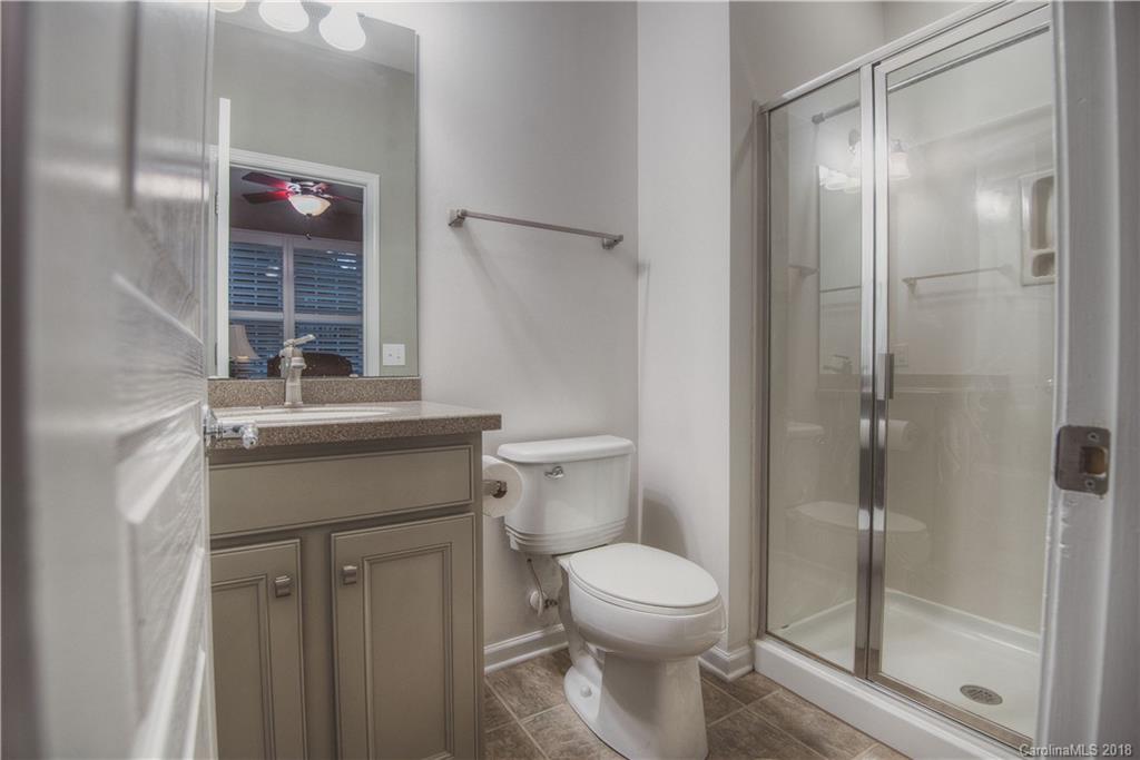 581 6th Baxter Crossing, Unit 1 Fort Mill, SC 29708 - Photo 21 of 34 a bathroom with a toilet sink and shower