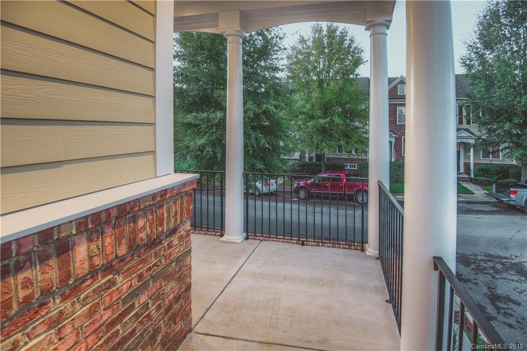 581 6th Baxter Crossing, Unit 1 Fort Mill, SC 29708 - Photo 6 of 34 a view of a porch with wooden floor