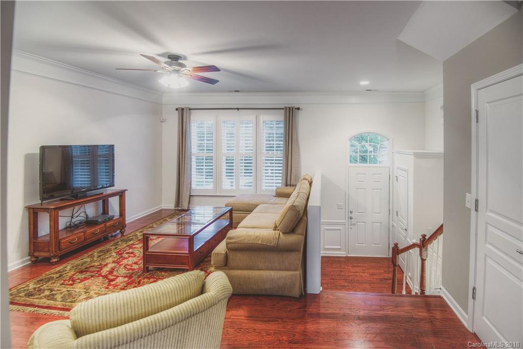 581 6th Baxter Crossing, Unit 1 Fort Mill, SC 29708 - Photo 9 of 34 a living room with furniture and a flat screen tv