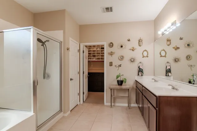a view of a bathroom with a sink a mirror and a shower