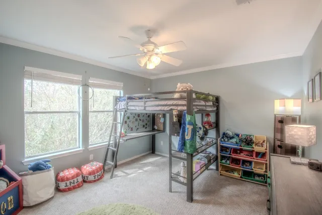 a view of a livingroom with furniture and a window