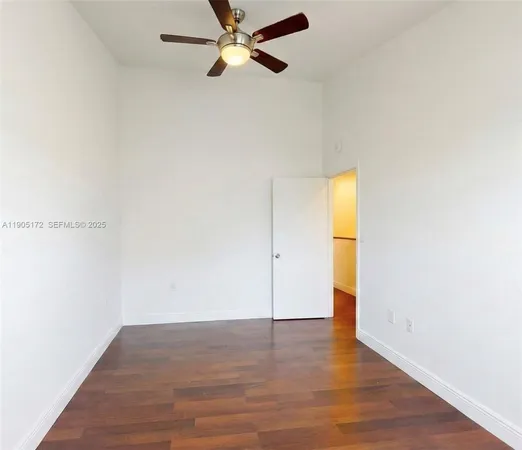 a view of a backyard with large trees