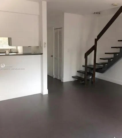 a view of a kitchen with a sink
