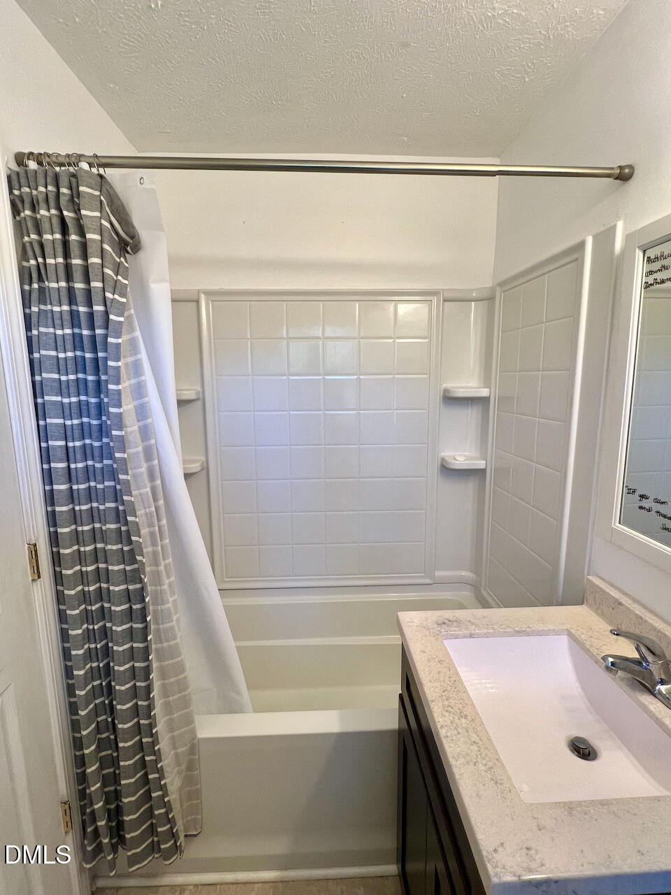 1421 Creech Road Garner, NC 27529 - Photo 16 of 22 a bathroom with a sink and a shower