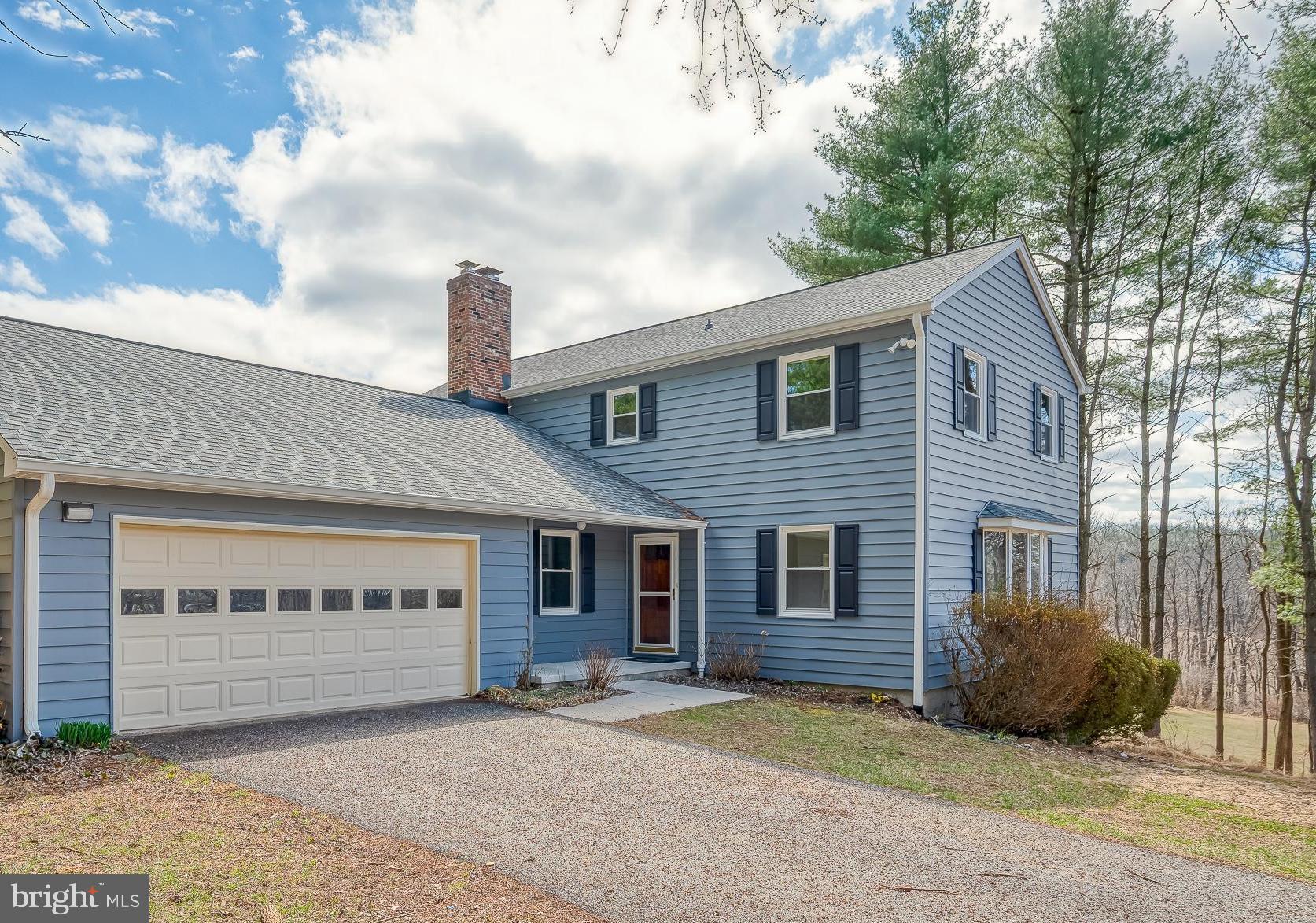 2713 Garrett Road White Hall, MD 21161 - Photo 2 of 60 a front view of a house with a garden