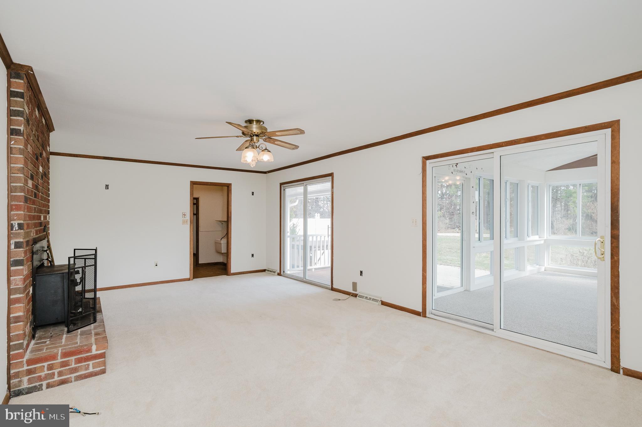 2713 Garrett Road White Hall, MD 21161 - Photo 22 of 60 a view of a livingroom with a ceiling fan and window