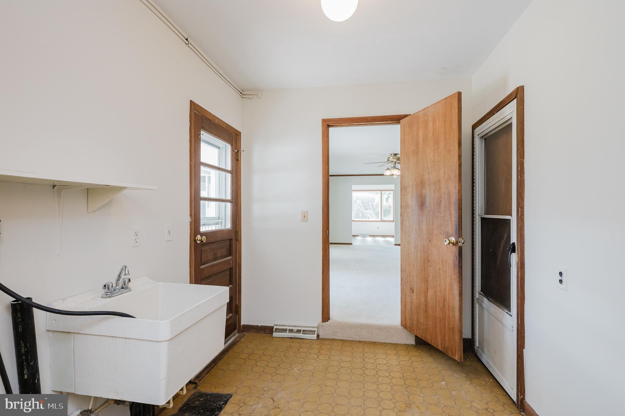 2713 Garrett Road White Hall, MD 21161 - Photo 26 of 60 a view of a room that has a sink and mirror