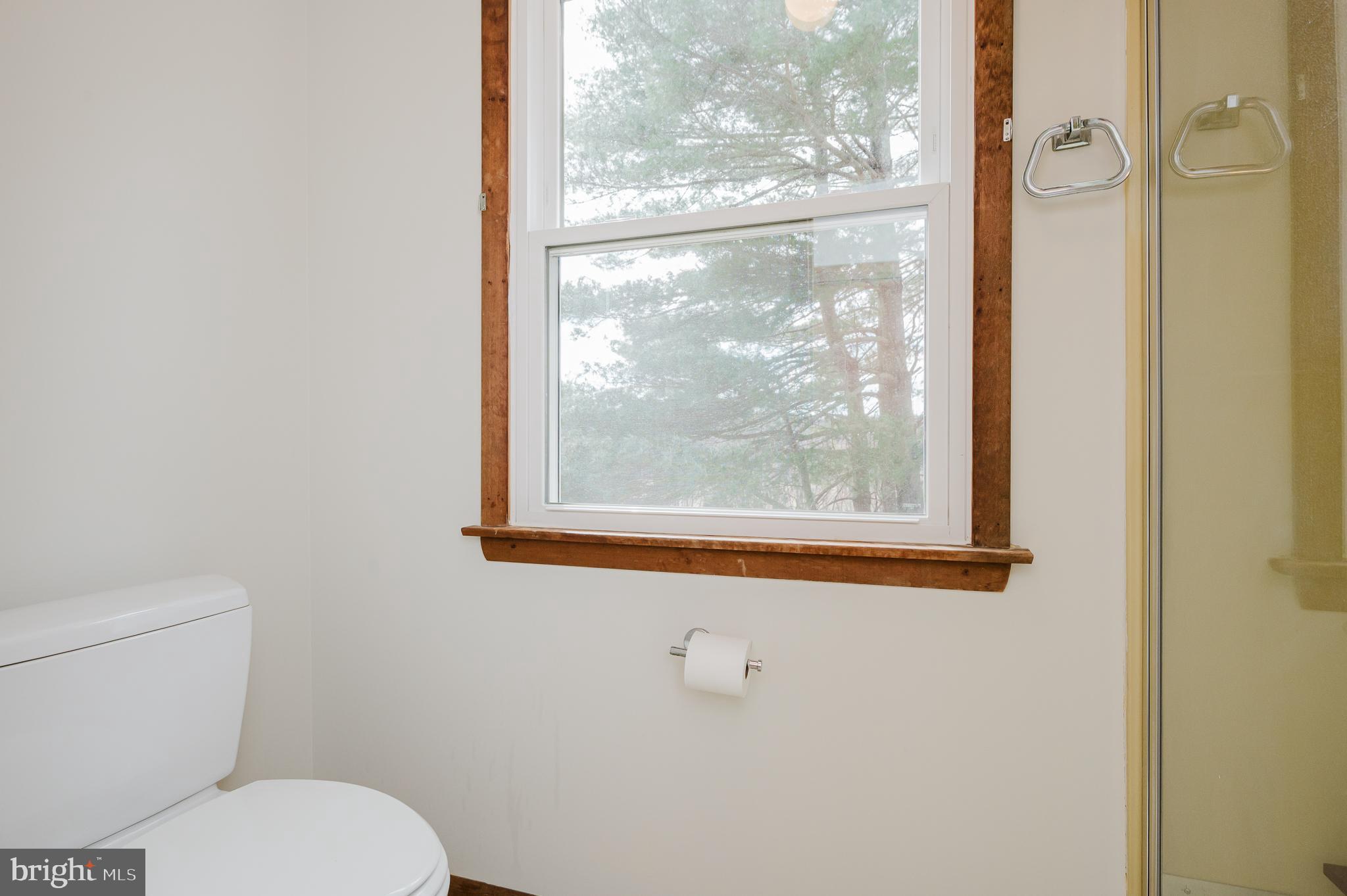 2713 Garrett Road White Hall, MD 21161 - Photo 34 of 60 a white toilet sitting next to a window