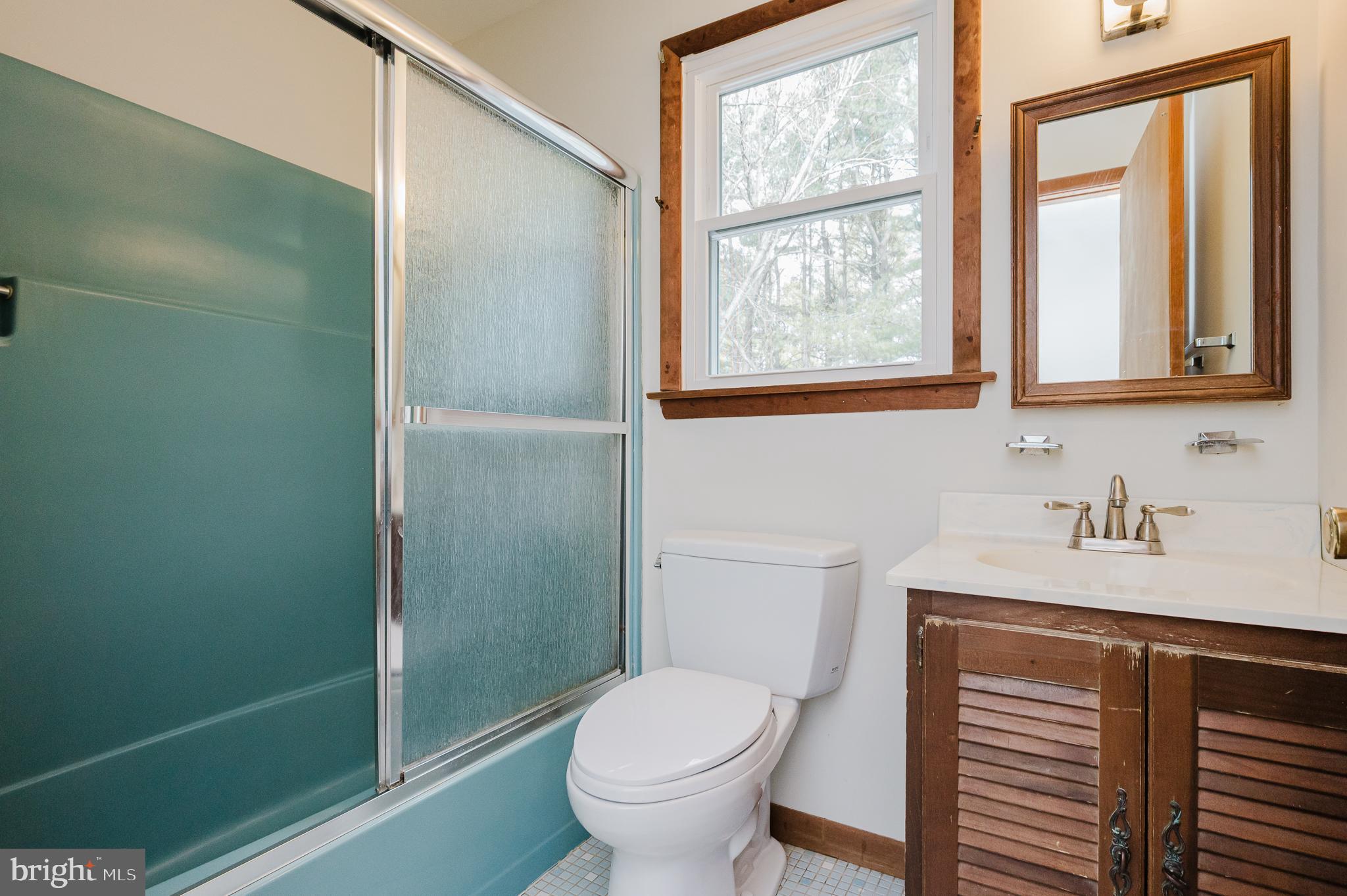 2713 Garrett Road White Hall, MD 21161 - Photo 38 of 60 a bathroom with a toilet sink and window