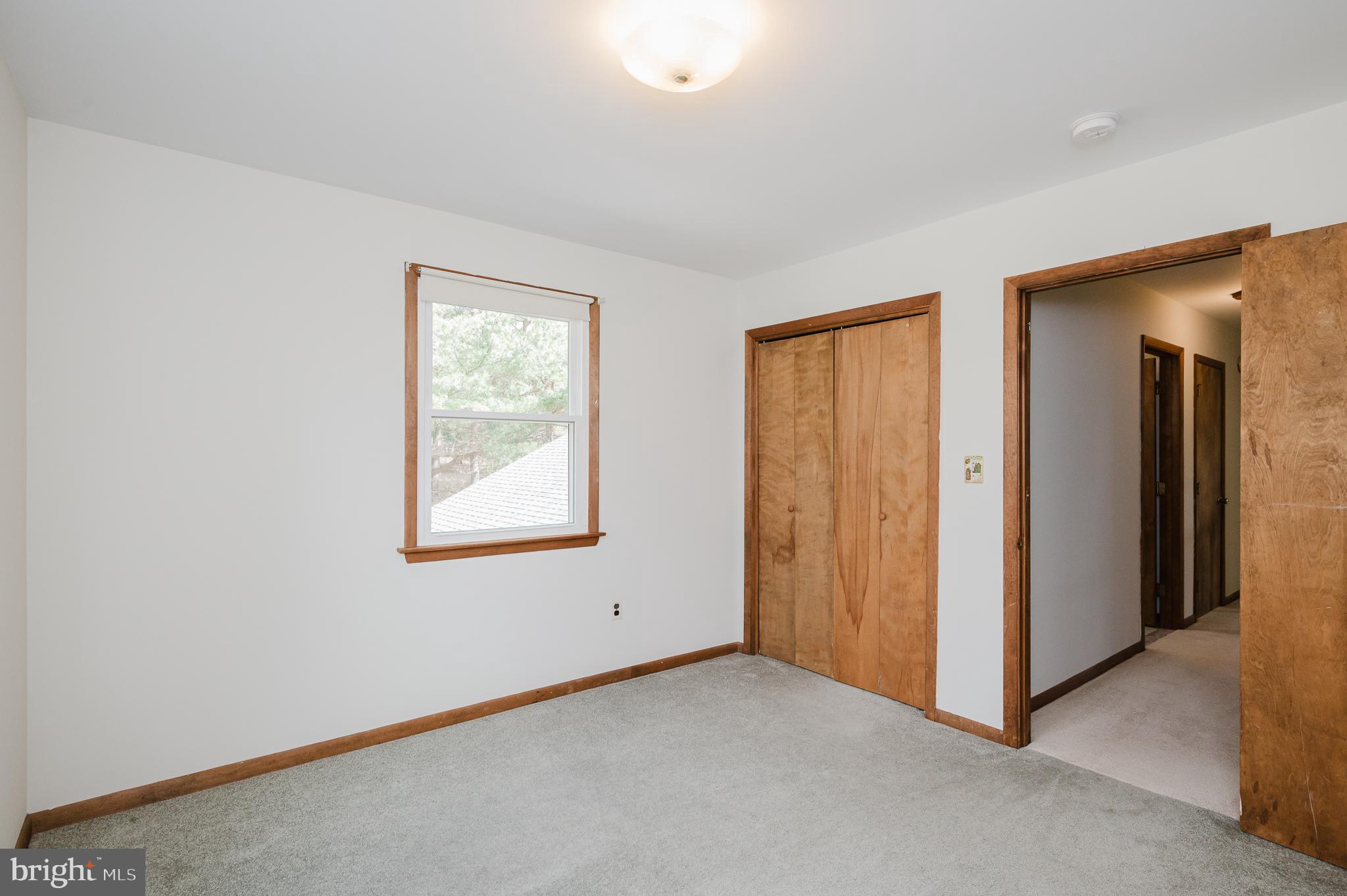 2713 Garrett Road White Hall, MD 21161 - Photo 39 of 60 a view of an empty room with window and closet area