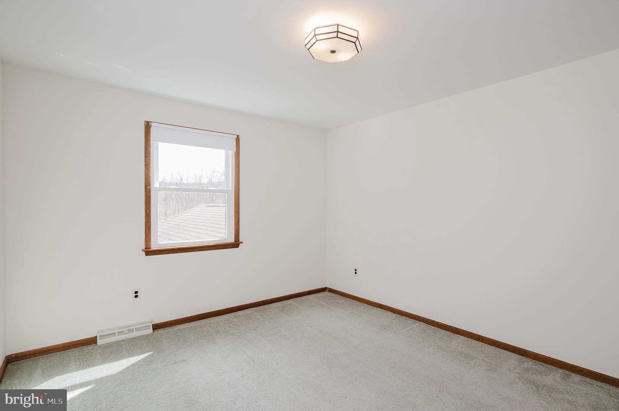 2713 Garrett Road White Hall, MD 21161 - Photo 40 of 60 an empty room with a window