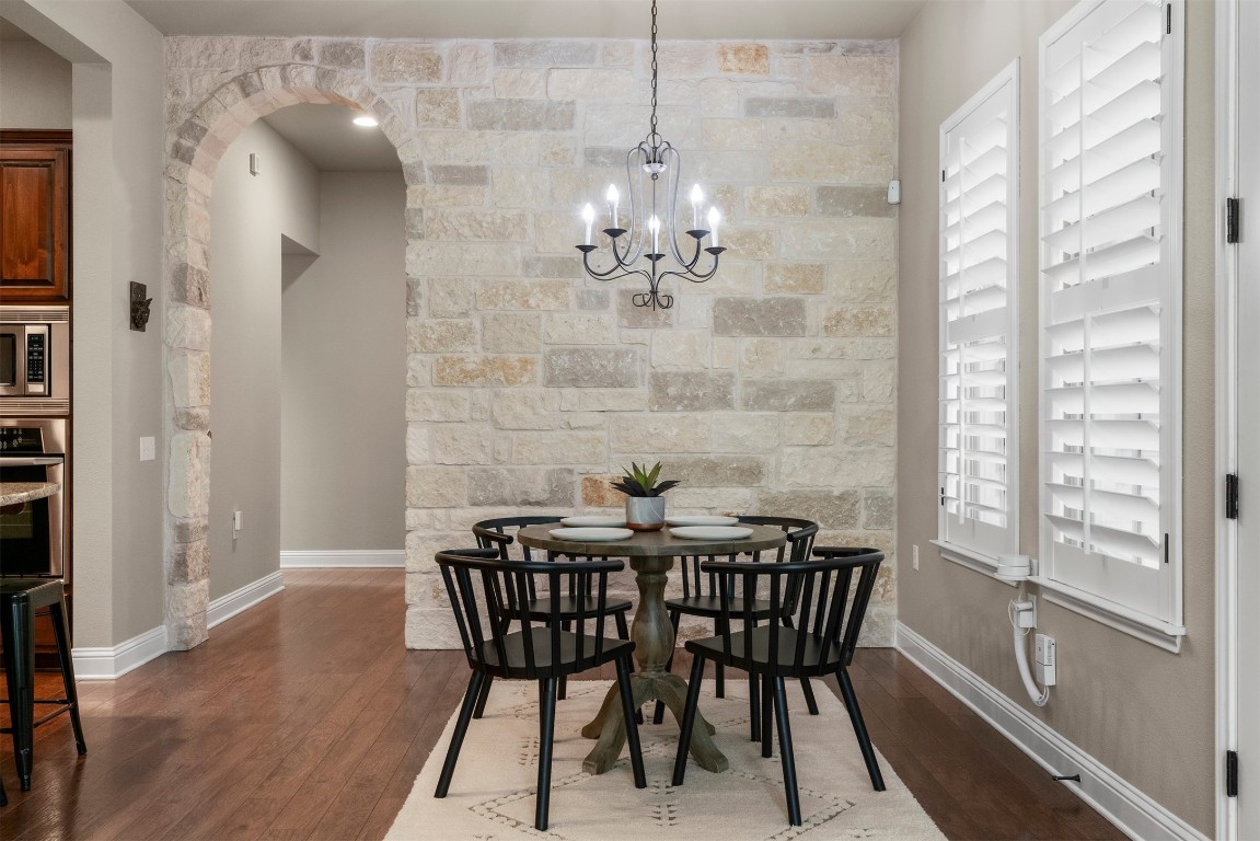 2020 Antone Street Austin, TX 78723 - Photo 15 of 35 a view of a dining room with furniture window and wooden floor