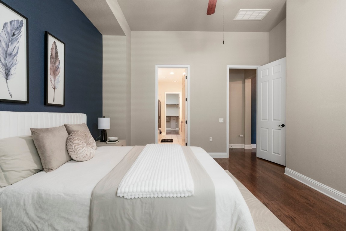 2020 Antone Street Austin, TX 78723 - Photo 22 of 35 a bedroom with a bed and a wooden floor