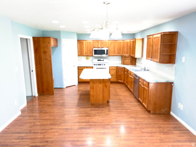 587 West 2400 South Perry, UT 84302 - Photo 21 of 46 Kitchen and dining area with solid wood cabinets and laminate flooring