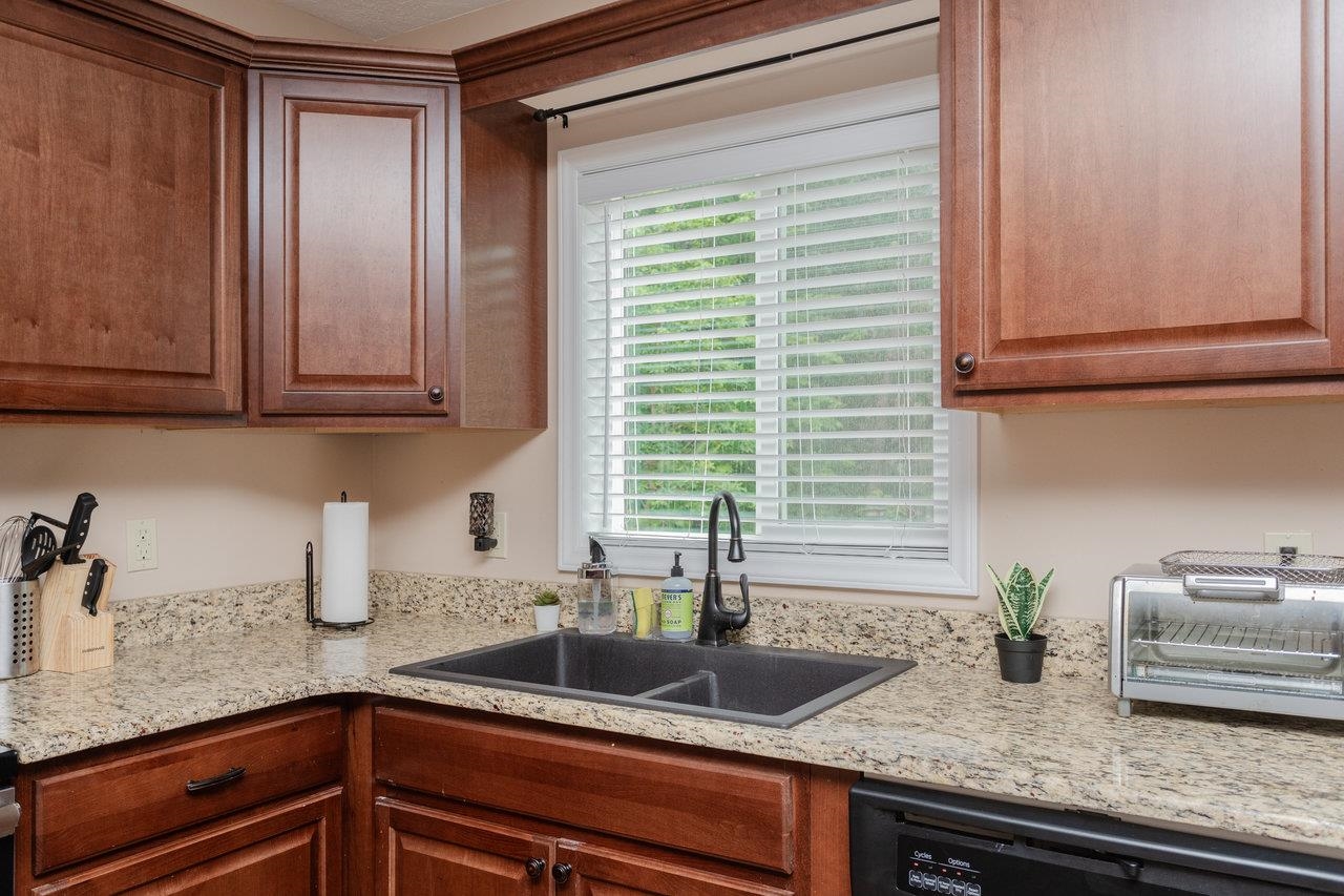 159 Park View Shenandoah, VA 22849 - Photo 14 of 70 a kitchen with granite countertop a sink and a white wooden cabinets