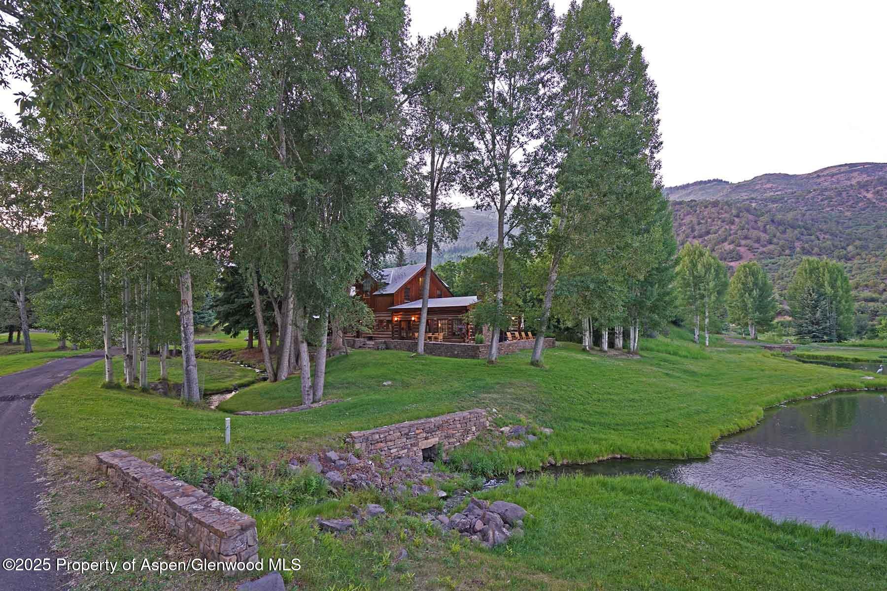 2650 Sweetwater Road Gypsum, CO 81637 - Photo 26 of 87 a view of a house with a backyard