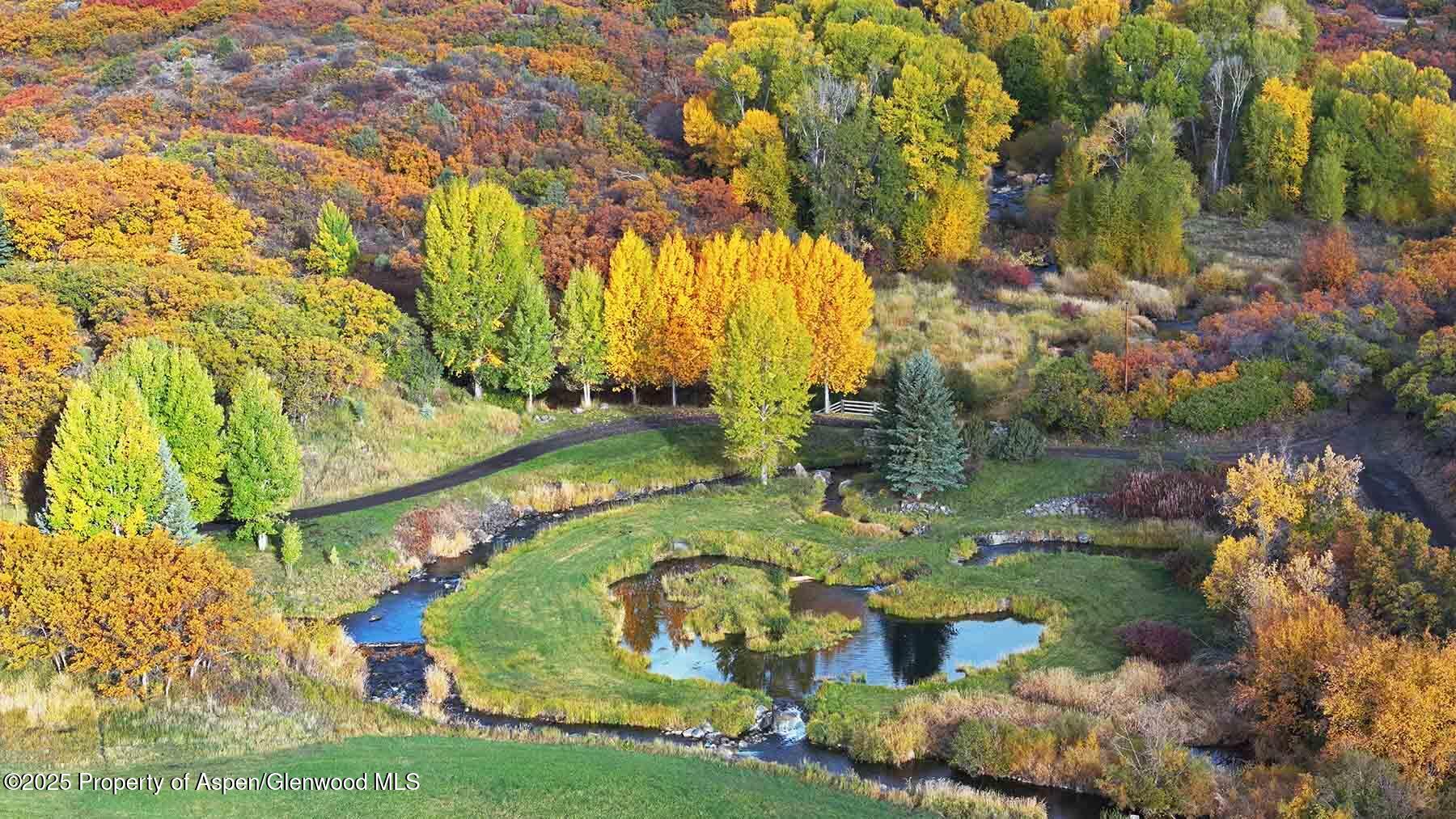 2650 Sweetwater Road Gypsum, CO 81637 - Photo 29 of 87 a view of swimming pool with a yard