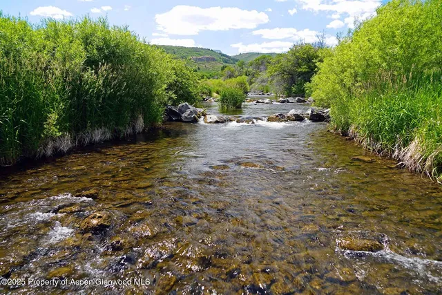 a view of lake with mountain