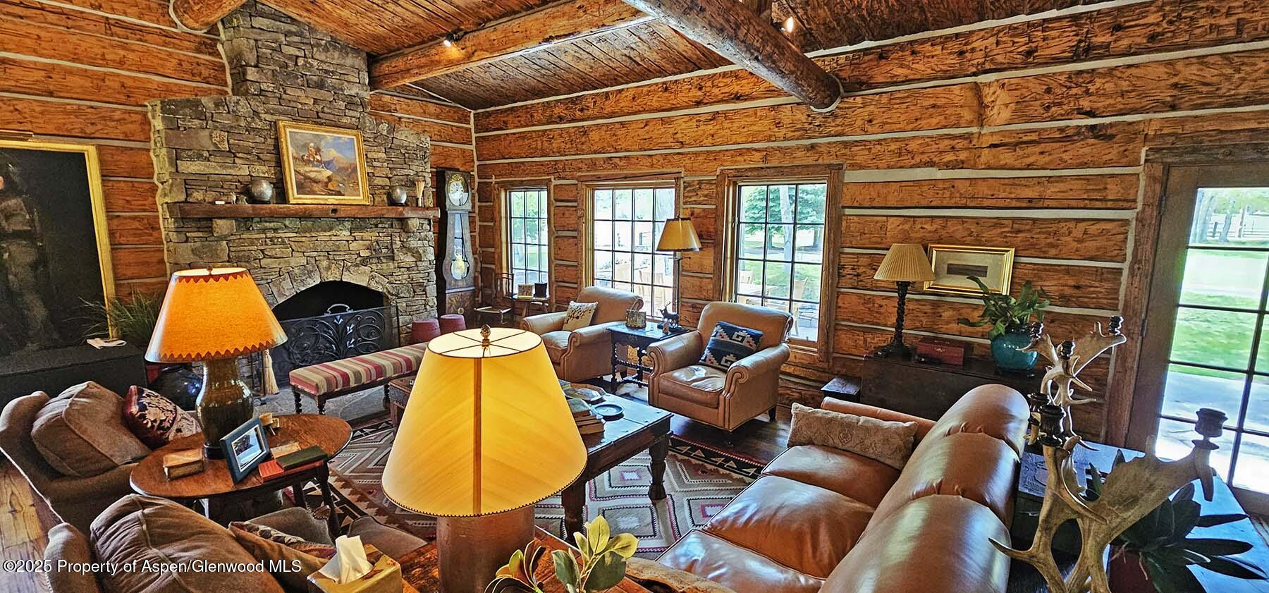 2650 Sweetwater Road Gypsum, CO 81637 - Photo 52 of 87 a living room with furniture and a fireplace