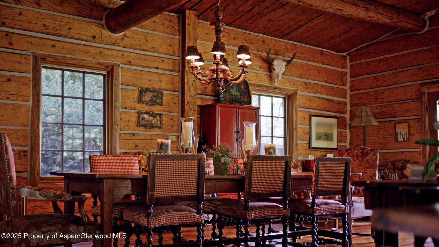 2650 Sweetwater Road Gypsum, CO 81637 - Photo 53 of 87 a view of a dining room with furniture and chandelier