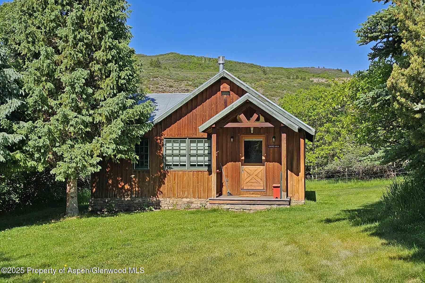 2650 Sweetwater Road Gypsum, CO 81637 - Photo 58 of 87 a front view of a house with garden