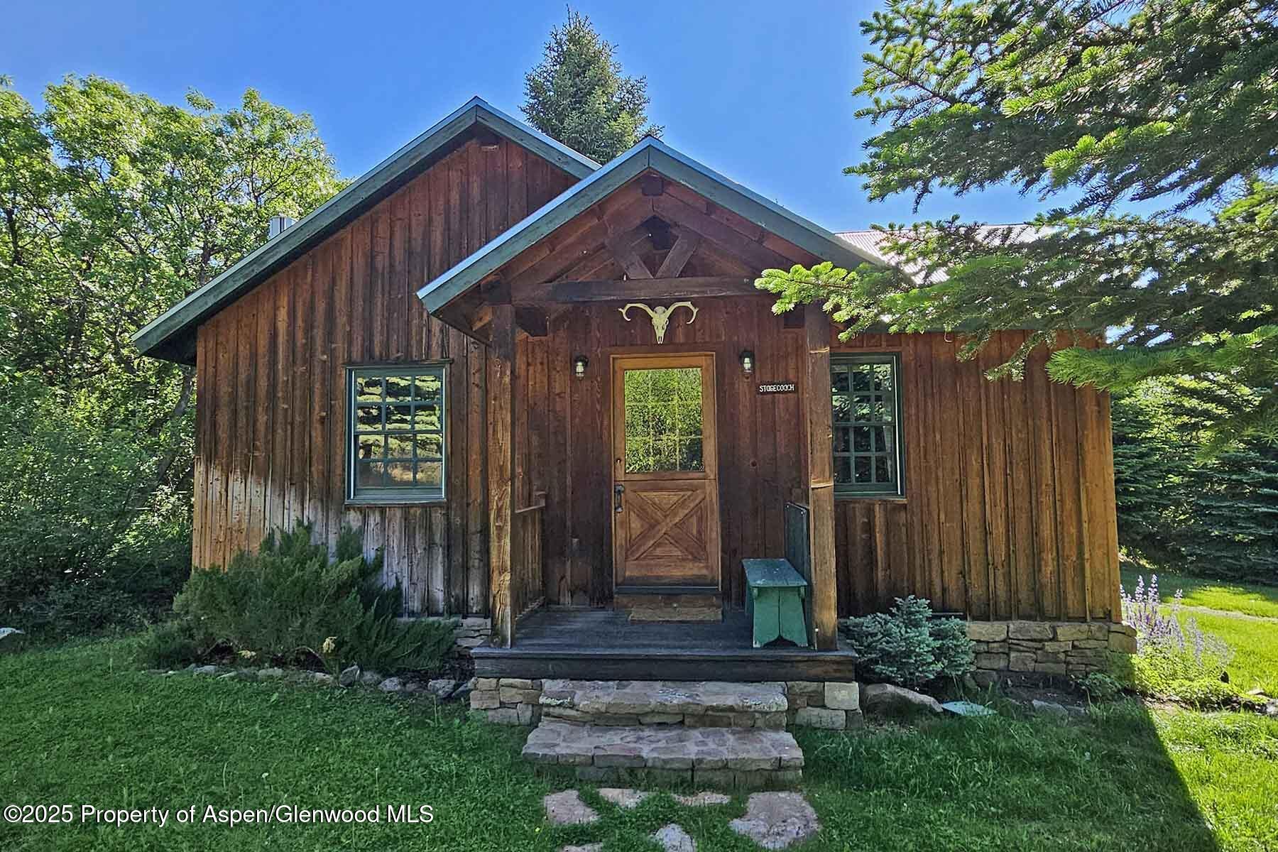 2650 Sweetwater Road Gypsum, CO 81637 - Photo 59 of 87 a front view of a house with garden