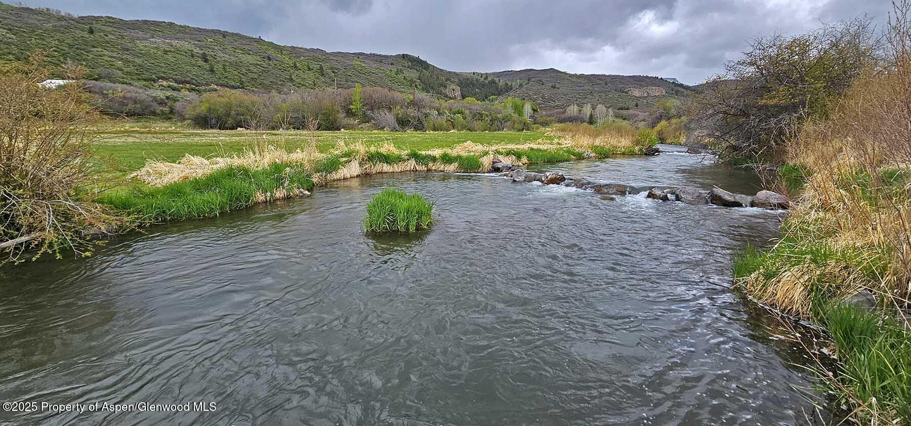 2650 Sweetwater Road Gypsum, CO 81637 - Photo 81 of 87 a view of a lake with mountains in the background