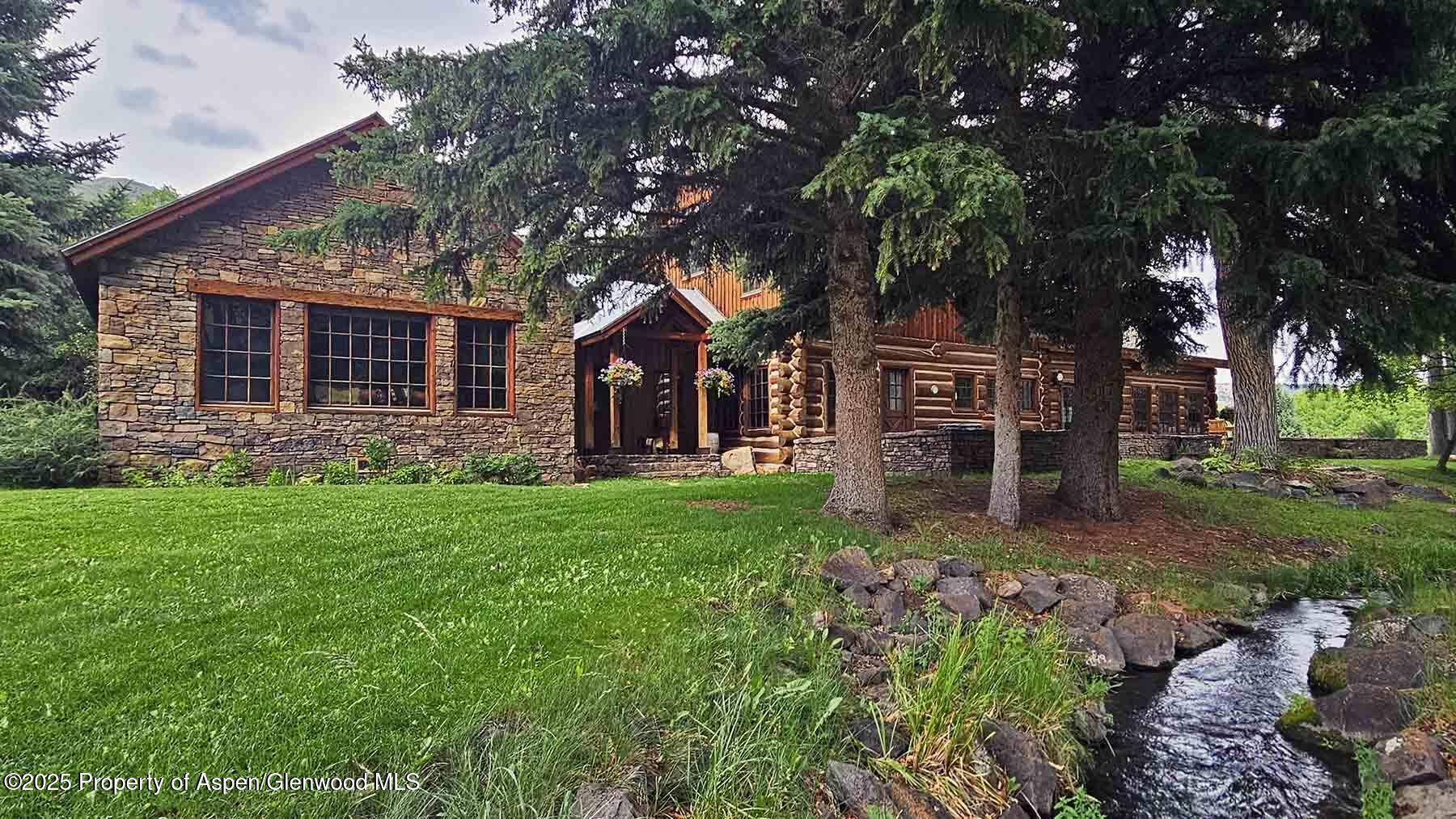 2650 Sweetwater Road Gypsum, CO 81637 - Photo 9 of 87 front view of a house with a big yard