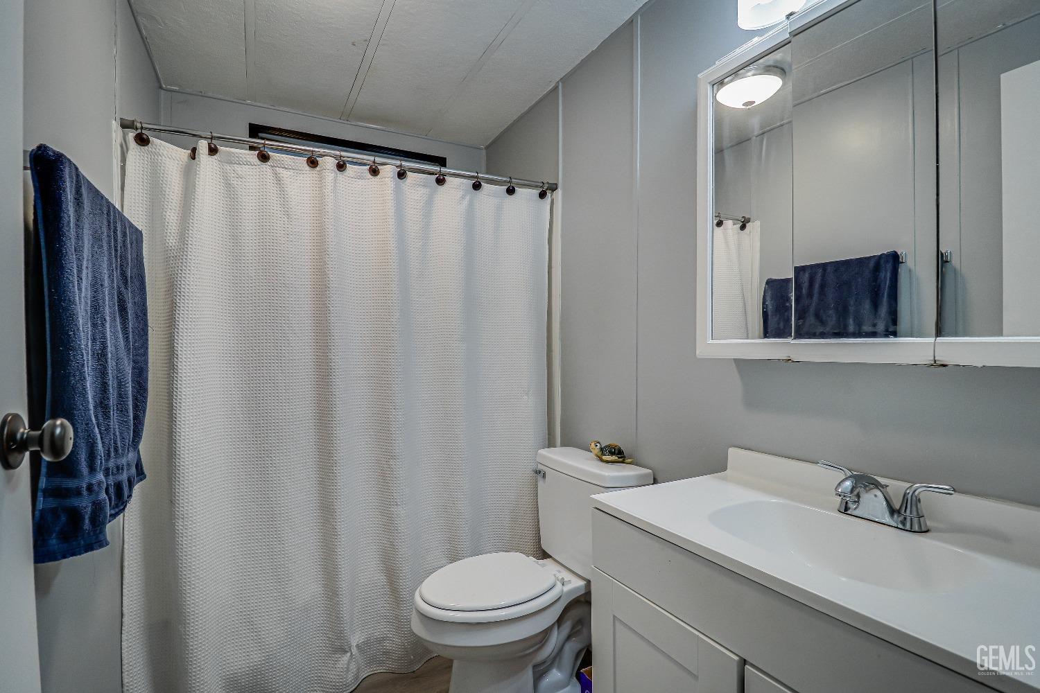 Undisclosed Address Bakersfield, CA 93312 - Photo 11 of 18 a bathroom with a sink toilet and shower
