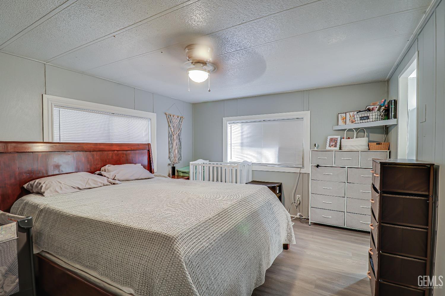 Undisclosed Address Bakersfield, CA 93312 - Photo 12 of 18 a bedroom with a bed and a window