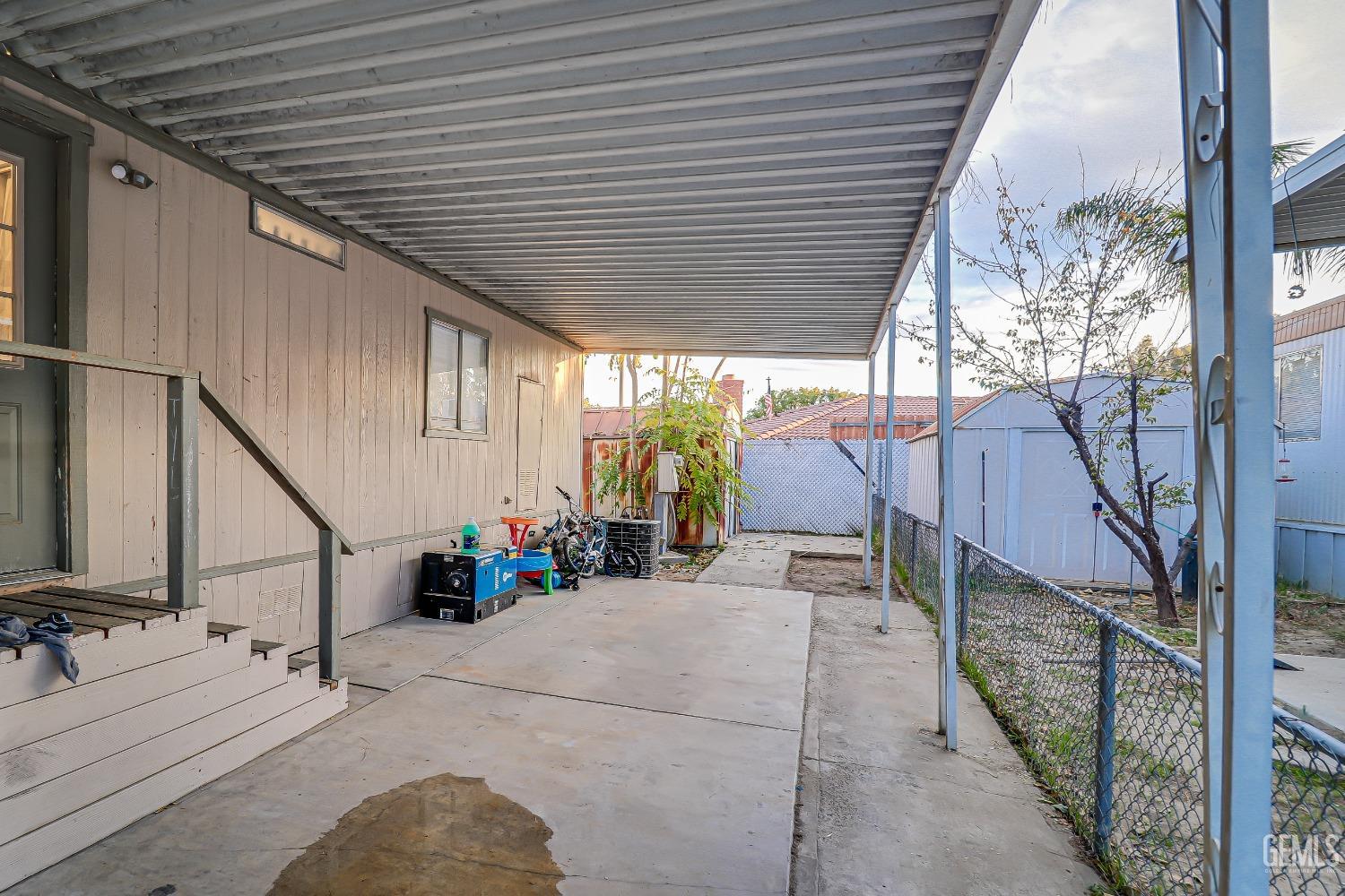 Undisclosed Address Bakersfield, CA 93312 - Photo 16 of 18 a view of house with wooden deck and sitting area