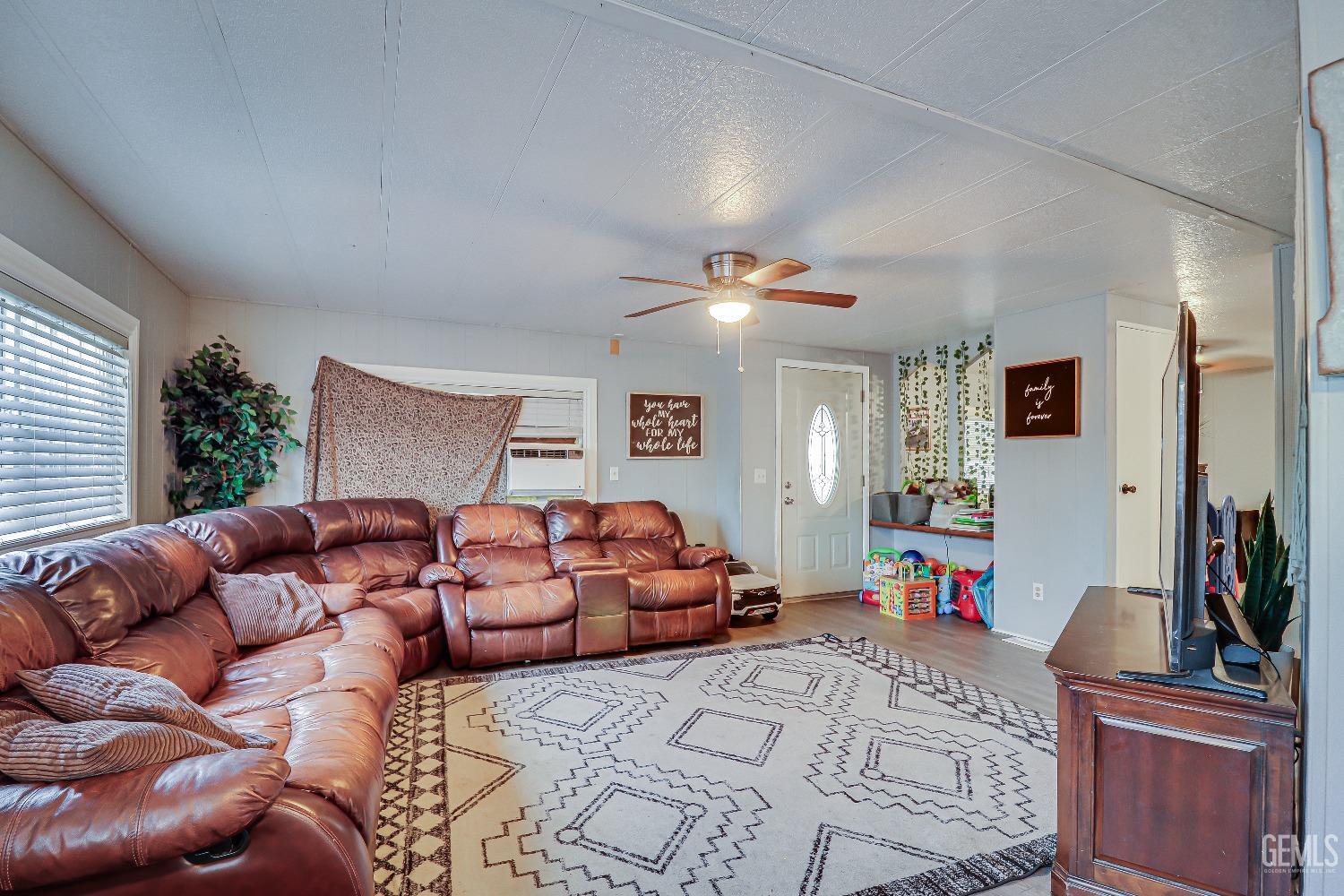 Undisclosed Address Bakersfield, CA 93312 - Photo 5 of 18 a bedroom with furniture and a flat screen tv