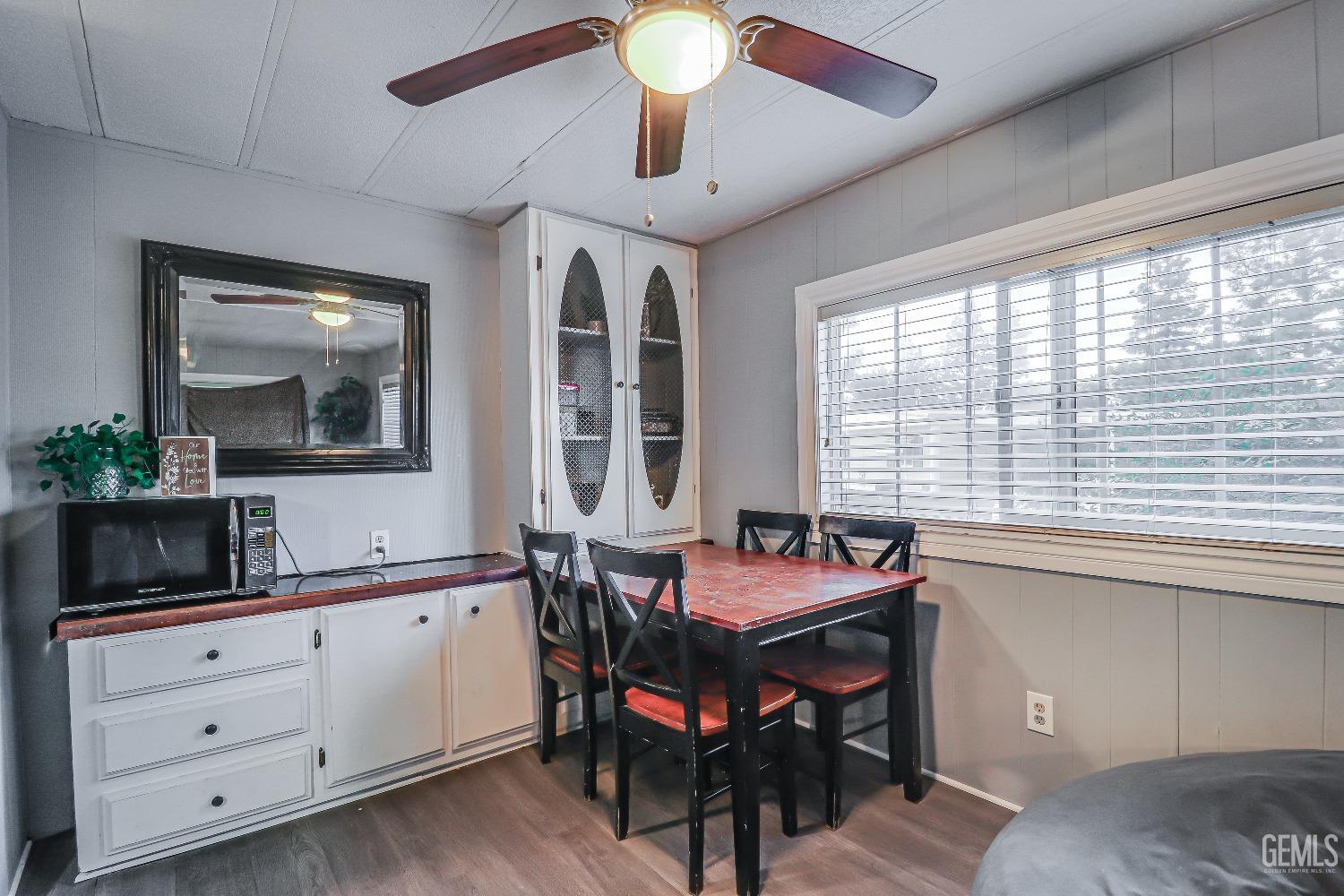 Undisclosed Address Bakersfield, CA 93312 - Photo 7 of 18 a dining room with a large window and furniture