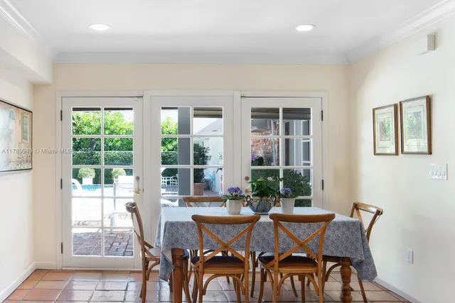 a view of a dining room with furniture and windows