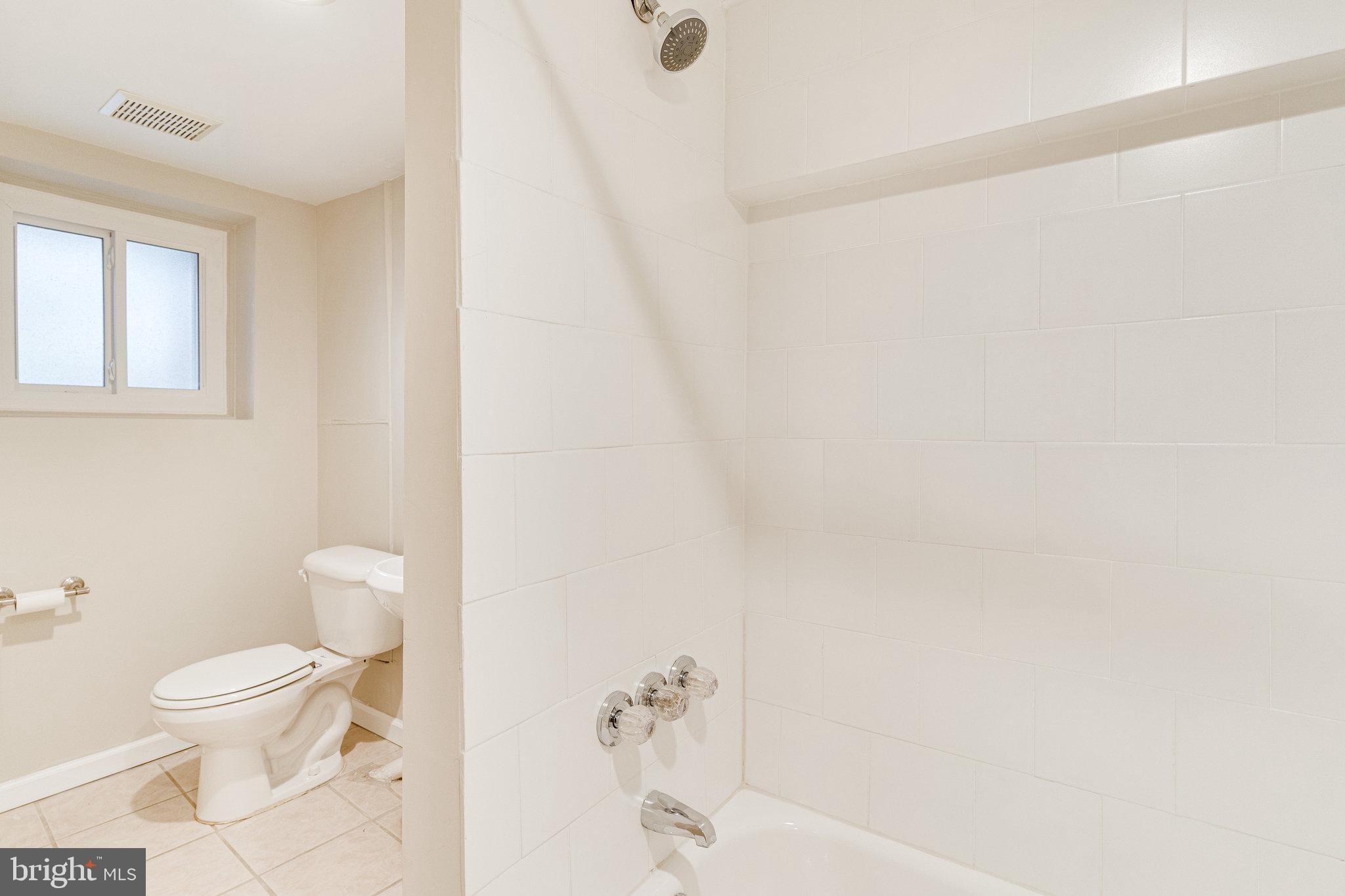 4215 7th Street Northwest Washington, DC 20011 - Photo 47 of 57 Basement bathroom tile surround tub/shower