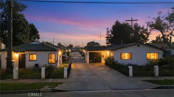 a view of a building with a yard
