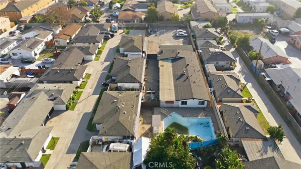 an aerial view of residential houses with outdoor space