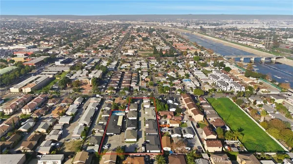 an aerial view of houses with trees