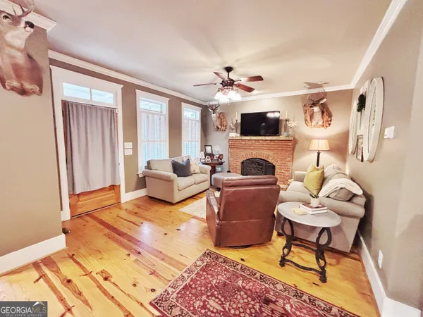 a living room with furniture fireplace and a flat screen tv