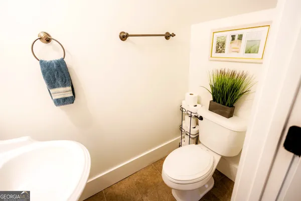 a bathroom with a toilet and a sink