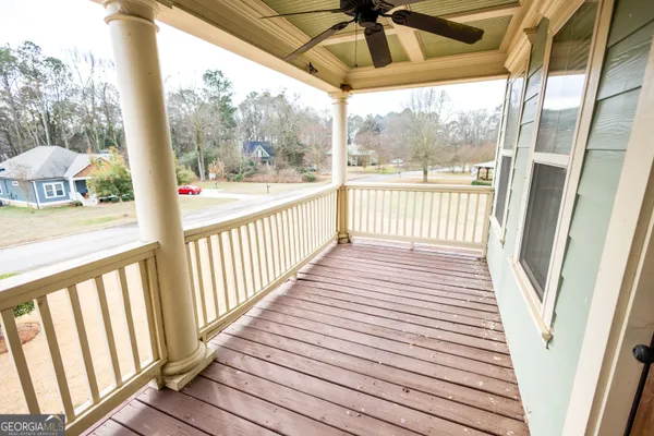 a view of a balcony with wooden floor