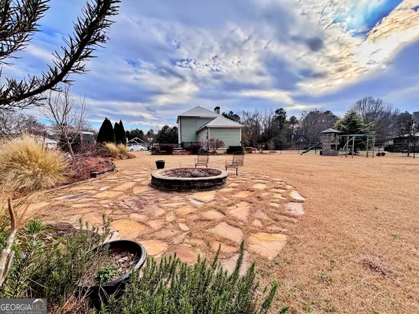 a view of a backyard of the house