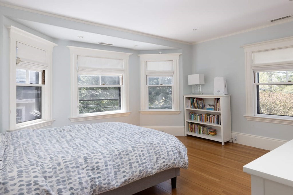 12 Balcarres Road Newton, MA 02465 - Photo 15 of 22 a bedroom with a bed and a book shelf